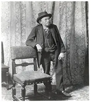 Hunchbacked Prints: Port. Charles Steinmetz Leans On Chair
