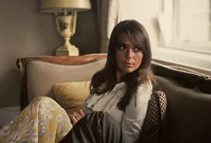 Prints of Portrait of American actress Natalie Wood (1938 - 1981) as she sits on a sofa and looks over her shoulder, late 1960s. (Photo by Tim Boxer/Getty Images) Grace, Glamour & Timeless Elegance: Portarit Of Natalie Wood
