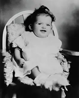 Prints of American actress, singer and glamour model Jayne Mansfield (1933-1967) pictured as a three-month-old girl, sitting in a high chair at Laubach's department store in Easton, Pennsylvania, July 1933 Hollywood's Blonde Bombshell in Focus: Portrait Of The Actress As A Young Girl