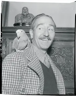 Portrait of Adolphe Menjou With His Parrot