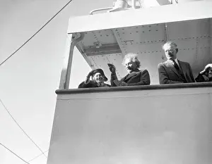 Prints of (Original Caption). Professor Albert Einstein, world-famed exponent of the theory of relativity and the fourth dimension, is joined by Mrs A Glimpse into Genius: Portrait of Albert Einstein and Wife Waving