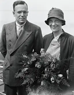 Prints of (Original Caption). Accompanied by her husband, George P. Putnam, Mrs The Sky's Trailblazer: Portrait of Amelia Earhart and George Putnam