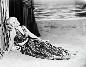 Portrait of Bette Davis Lounging in Beach Ensemble