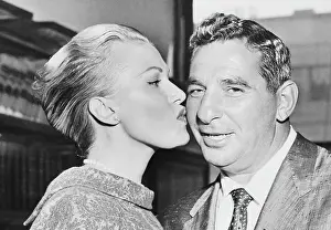 Portrait of Former Celtics Irving Resnick Being Kissed by His Wife