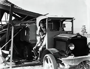 Prints of Undated photograph of Laurel and Hardy sitting in a truck Timeless Comedy Icons: Classic Moments from the Legendary Duo: Portrait of Comedy Team Laurel and Hardy