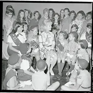 Portrait of Debbie Reynolds with Girl Scouts