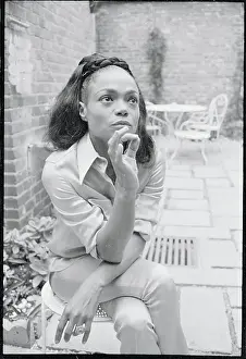 Prints of (Original Caption). A thoughtful Eartha Kitt thinks back to the first dollar she ever earned with a mixture of humor and sadness Captivating Art Prints Celebrating the Iconic Performer’s Legacy: Portrait of Eartha Kitt