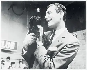 Portrait of Emcee Sonny Fox Holding Dog