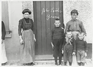 Portrait of Family on Doorsteps