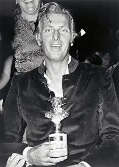 Capri Prints: Portrait of French Designer Givenchy Holding Trophy