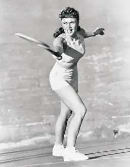 Portrait of Ginger Rogers Playing Tennis