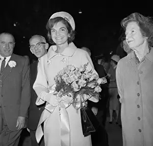 Portrait of Jackie Kennedy Carrying Bouquet of Flowers