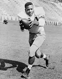 Portrait of Jim Brown Holding Football
