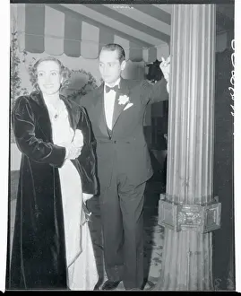 Prints of (Original Caption). Joan Crawford and Franchot Tone waiting for their car outside the Trocadero Cafe A Glamorous Life Captured: Portrait of Joan Crawford and Franchot Tone