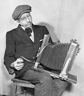 Portrait of Langley Collyer Examining Camera