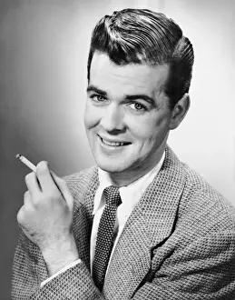 Portrait of man holding a cigarette
