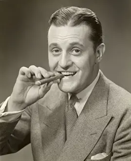 Portrait of man smoking cigar
