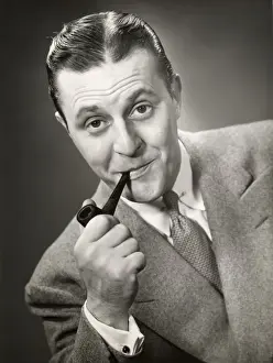 Portrait of man smoking pipe