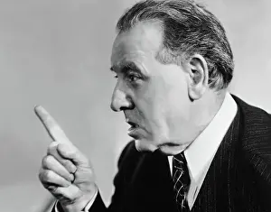 Portrait of mature man speaking with authority