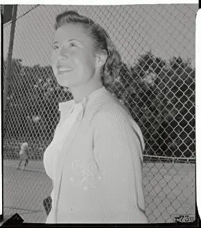 Portrait of Maureen Connolly Standing by Fence