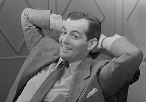 Hands Behind Head Prints: Portrait of mid adult man smiling