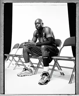 Portrait of NBA player Dwyane Wade wearing Team USA jersey sitting