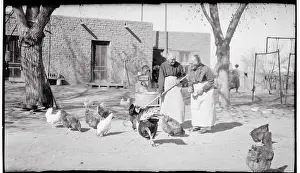Portrait of Oldest Twins Tending Chickens