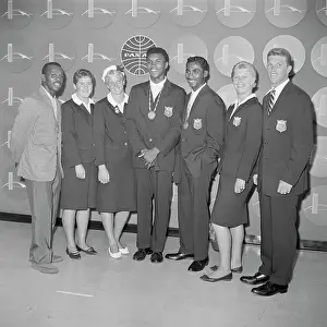 Prints of (Original Caption). Seven American Olympians who earned gold medals at Rome arrive at New York's Idlewild Airport, September 8th. Left to right are: Sgt A photo tribute to the boxing legend: Portrait Of Olympic Gold Medalists