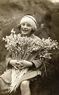 Gap Toothed Prints: Portrait of a Smiling Girl Holding a Bunch of Flowers