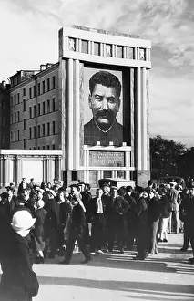 Communism Prints: Portrait of Stalin Hanging on Building