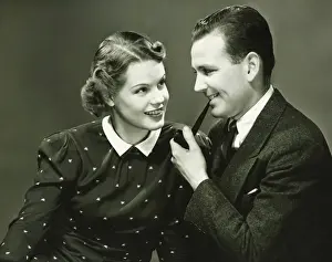 Polka Dot Prints: Portrait of young couple, man holding pipe, smiling, (Portrait)