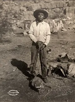 Time Captured: Vintage Art: Portrait of young man of Havasupia tribe with captured raccoon on chain