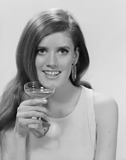 Portrait of young woman with wineglass