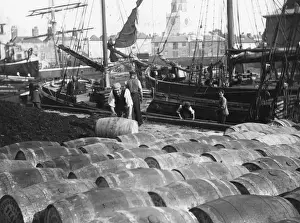 Prints of circa 1900: Barrels being unloaded from a ship in Portsmouth Dock. (Photo by F J Mortimer/Getty Images) Francis James Mortimer (1874-1944) Prints: Portsmouth Docks
