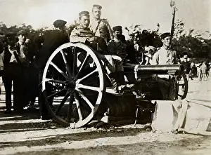Cannon Prints: Portuguese Revolution;Men Seated On Cann