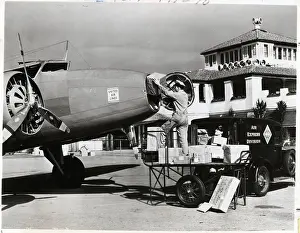 Postal Service Prints: Postal Worker Loads Packages Into Plane