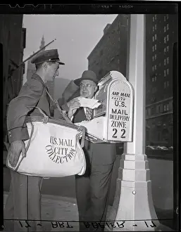 Postman Collects Mail in New York