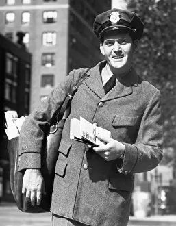 Mailbag Prints: Postman in street, portrait