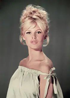Prints of circa 1960: Studio portrait of actor and model Brigitte Bardot wearing a light blue off-the-shoulder dress. (Photo by Hulton Archive/Getty Images) Iconic Movie Star Prints (1920s–1970s): Pouting Bardot
