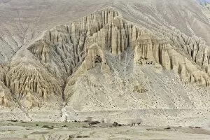 Prehistoric caves in a bizarre erosion landscape, near Ghami, Upper Mustang, Lo, Nepal