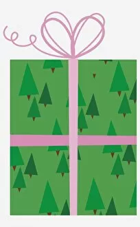 Present with tree pattern wrapping paper and pink bow at the top