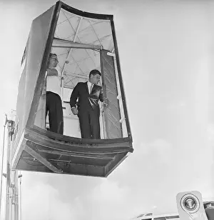 President John F. Kennedy Riding a Cherry Picker