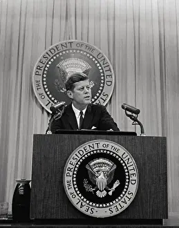 President John F. Kennedy Speaking at Podium