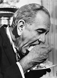 President Johnson Eating Wedding Cake