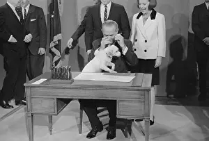 President Johnson Trying to Sign New Bill