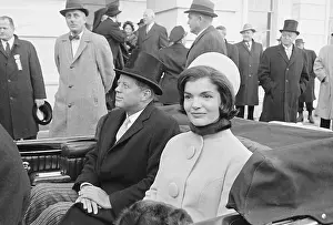 President Kennedy Seated in Car with Wife