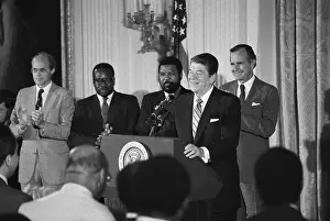 Prints of (Original Caption). President Reagan charging that he has been maligned by A lot of demagoguery and far-reaching commitment to civil rights is shown Echoes of Justice: Civil Rights in Focus: President Reagan Addressing African American Appointees