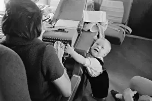 Typing Prints: President's Grandson Typing with Journalist Helen Thomas