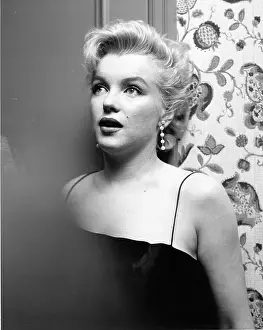 Prints of LOS ANGELES - MARCH 3: Movie star Marilyn Monroe hosts a press party held at her home on March 3, 1956 in Los Angeles, California. (Photo by Earl Leaf/Michael Ochs Archives/Getty Images) Marilyn Monroe: The Iconic Muse Prints: Press Party At Marilyn's