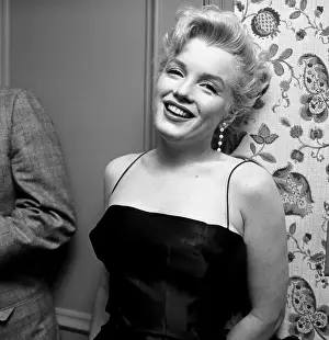 Prints of LOS ANGELES - MARCH 3: Movie star Marilyn Monroe hosts a press party held at her home on March 3, 1956 in Los Angeles, California. (Photo by Earl Leaf/Michael Ochs Archives/Getty Images) Marilyn Monroe: The Iconic Muse Prints: Press Party At Marilyn's